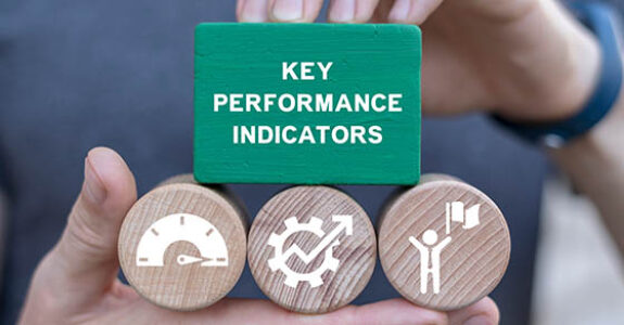 Man,Holding,Blocks,With,Icons,Sees,Inscription:,Key,Performance,Indicators.