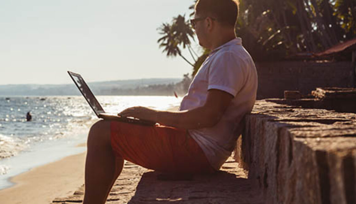 Man,On,Beach,With,Laptop,,Vietnam,,Mui,Ne