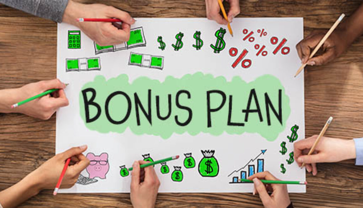 People,Drawing,Bonus,And,Employee,Compensation,On,Paper