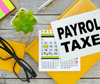 Payroll,Taxes,.,Multicolored,Stickers,And,Yellow,Notepad,With,Notepad